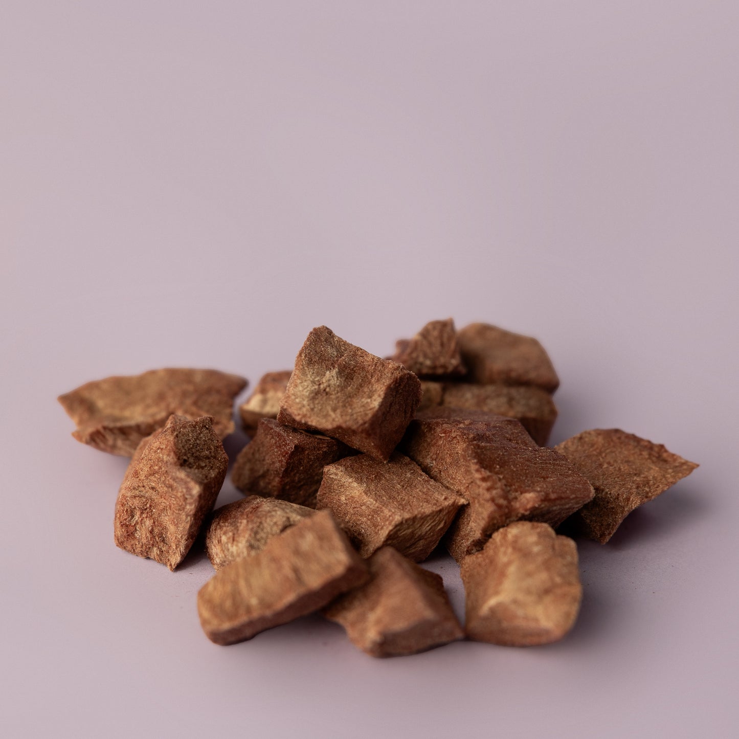 freeze dried dog treat, single ingredient dog treat on purple background