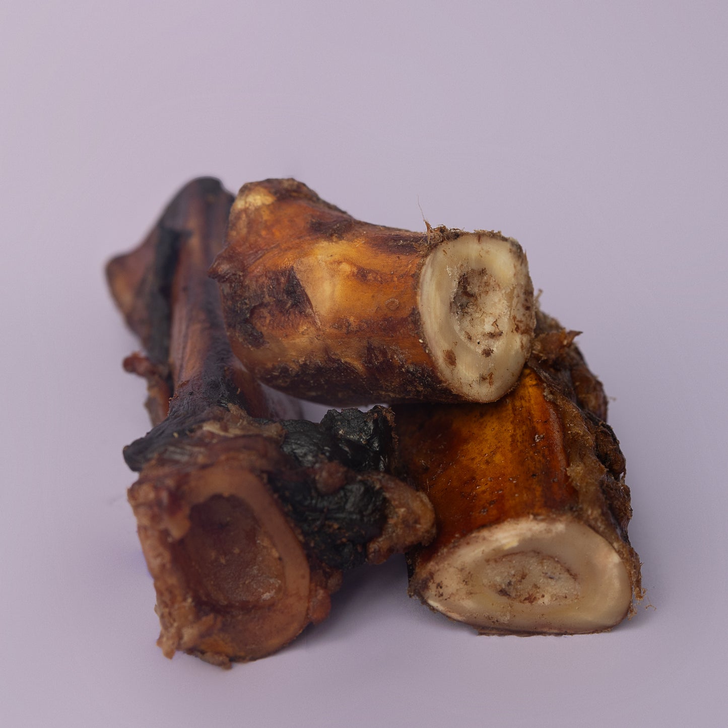 organic beef bone for dogs, cold smoked bone for dogs, marrow dog bone, power chew bone for dogs, non splintering bone for dogs on purple background