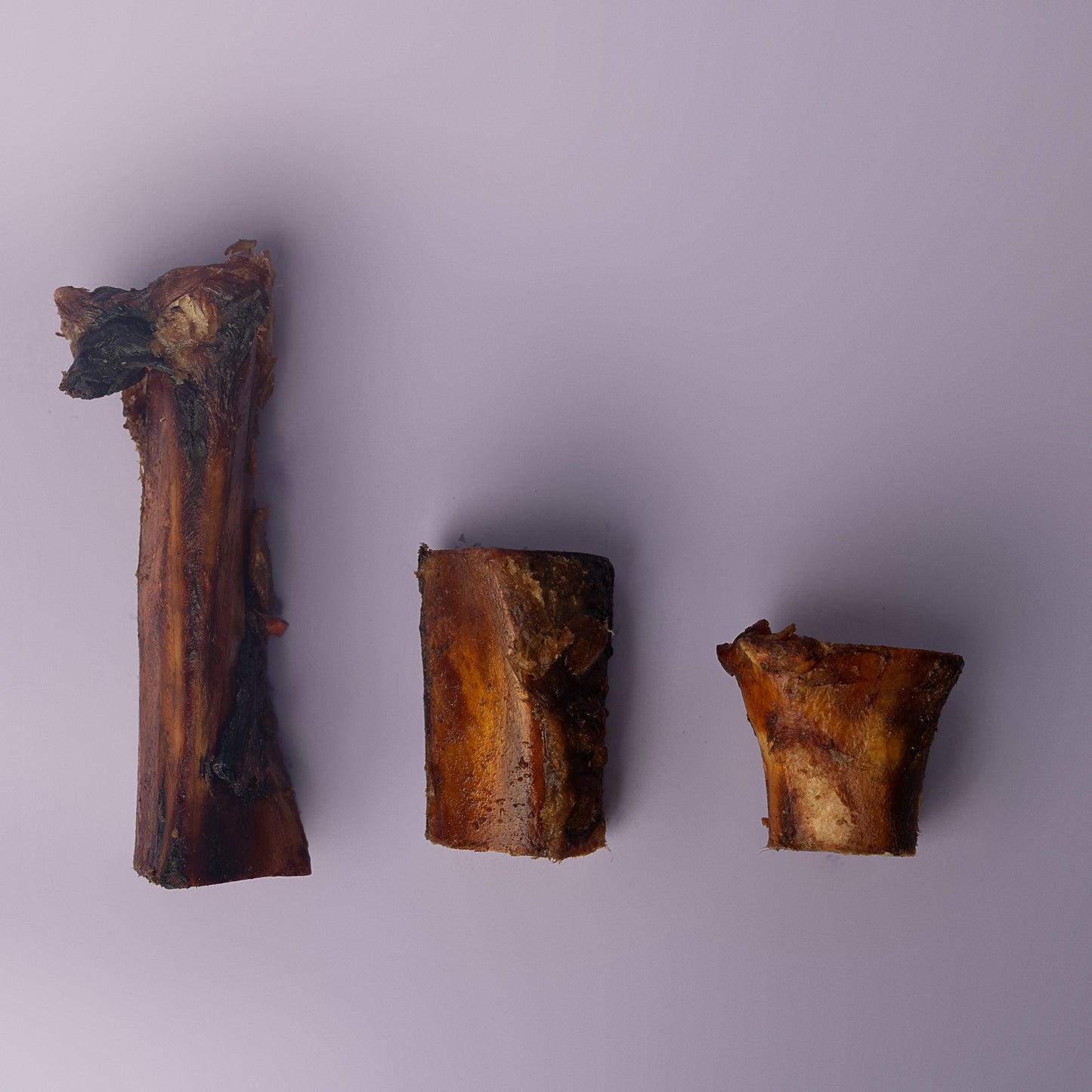 organic beef bone for dogs, cold smoked bone for dogs, marrow dog bone, power chew bone for dogs, non splintering bone for dogs on purple background