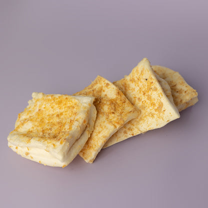 bully stick dusted beef cheek chip perfect for teething puppies on a purple background