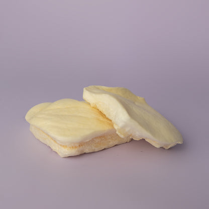 two puffy white beef cheek chips on a purple background; teething puppy cchew