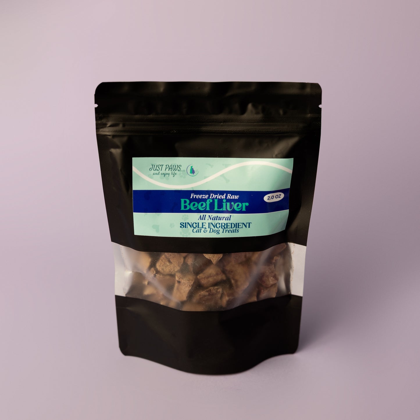 Black bag of freeze-dried raw beef liver treat for pets on a light purple background, single ingredient treat