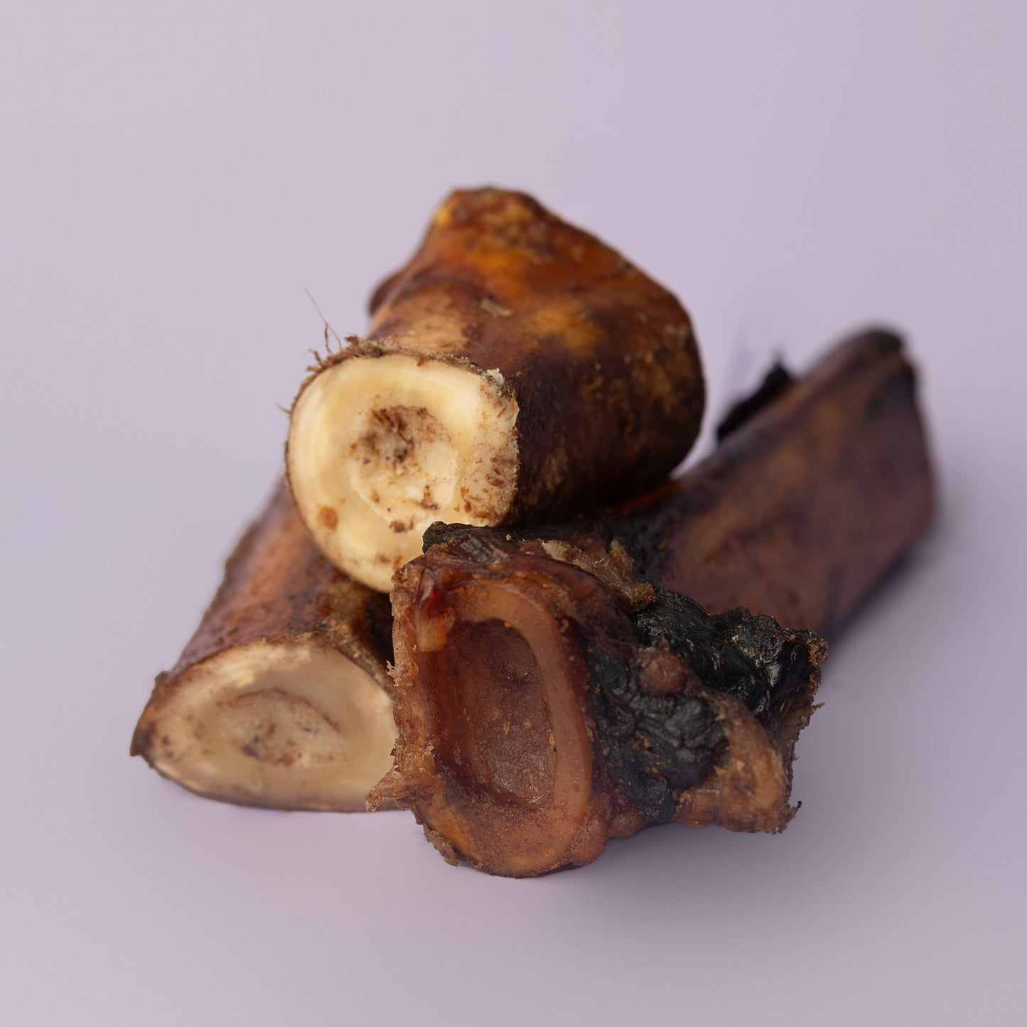 organic beef bone for dogs, cold smoked bone for dogs, marrow dog bone, power chew bone for dogs, non splintering bone for dogs on purple background