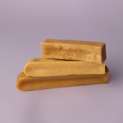 stacked yak chews on purple background, power chew for dogs, power chew for pitbulls, strong dog chew, best value dog chew, long lasting dog chew